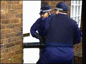 Police ramming house door