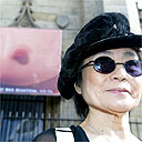 Yoko Ono and a picture of a large breast